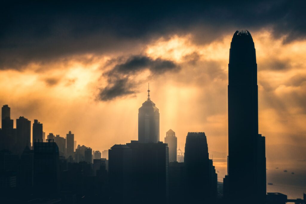 silhouette photography of high-rise buildings during golden hour